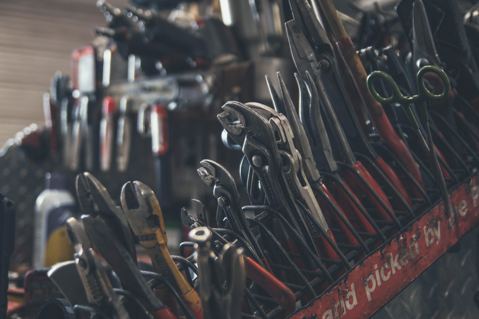 Plumbing pliers and hand tools in a tool bag